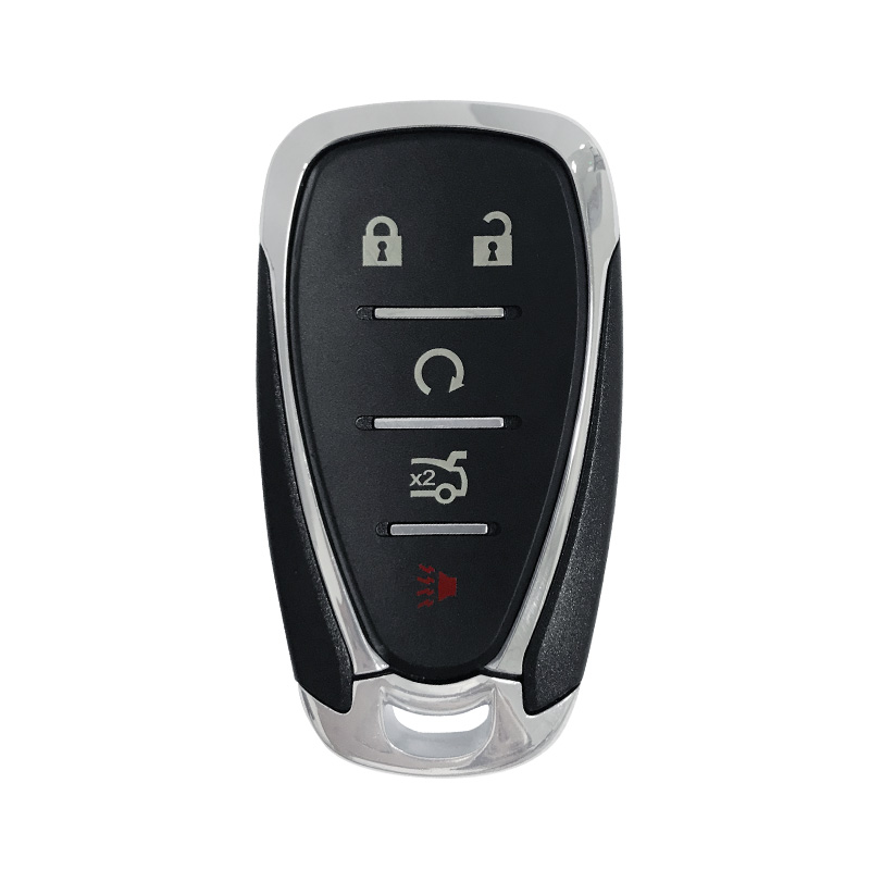 How are electronic components such as transponders or remote control features integrated into car keys during the manufacturing process?